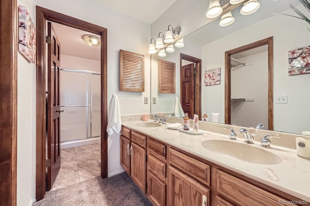 2299 Ranch Dr, Westminster, CO 80234 - bathroom featuring double vanity and a shower stall