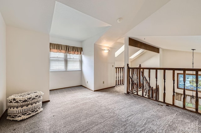 2299 Ranch Dr, Westminster, CO 80234 - carpeted spare room featuring vaulted ceiling, a smoke detector, and baseboards