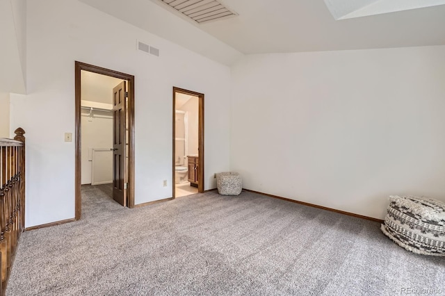 2299 Ranch Dr, Westminster, CO 80234 - unfurnished bedroom with lofted ceiling, a walk in closet, carpet, baseboards, and a closet