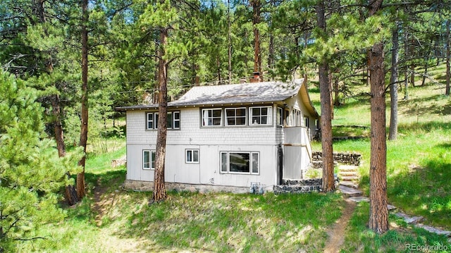 28958 Buffalo Park Rd, Evergreen, CO 80439 - view of outdoor structure featuring a wooded view