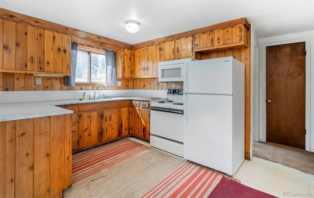28958 Buffalo Park Rd, Evergreen, CO 80439 - kitchen featuring white appliances, light countertops, light flooring, and brown cabinetry
