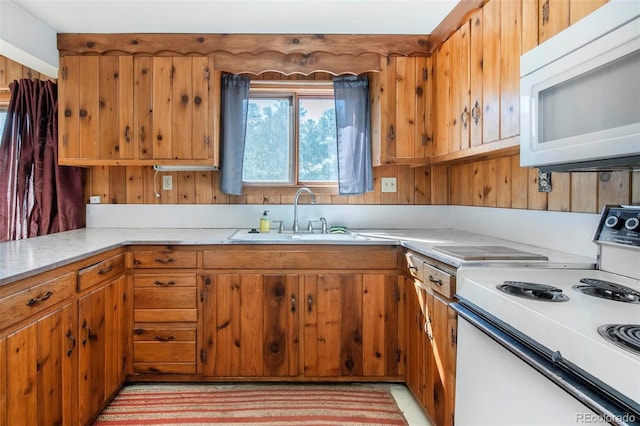 28958 Buffalo Park Rd, Evergreen, CO 80439 - kitchen with white appliances, light countertops, and brown cabinetry