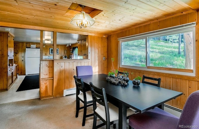 28958 Buffalo Park Rd, Evergreen, CO 80439 - dining space with wood ceiling, wooden walls, light carpet, and a baseboard heating unit