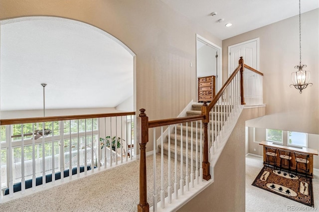 26155 E Euclid Dr, Aurora, CO 80016 - staircase with arched walkways, carpet floors, recessed lighting, and a chandelier