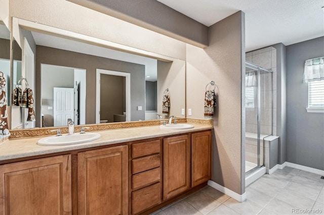 26155 E Euclid Dr, Aurora, CO 80016 - bathroom featuring a shower stall, double vanity, and tile patterned flooring