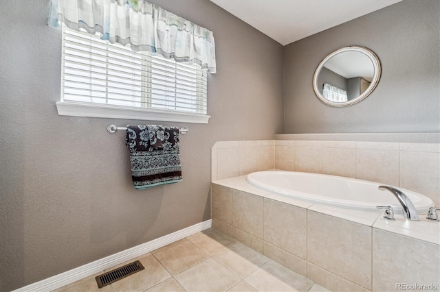 26155 E Euclid Dr, Aurora, CO 80016 - full bathroom featuring a garden tub and tile patterned floors