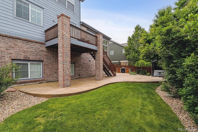 26155 E Euclid Dr, Aurora, CO 80016 - rear view of house with a patio area, stairs, brick siding, and a deck