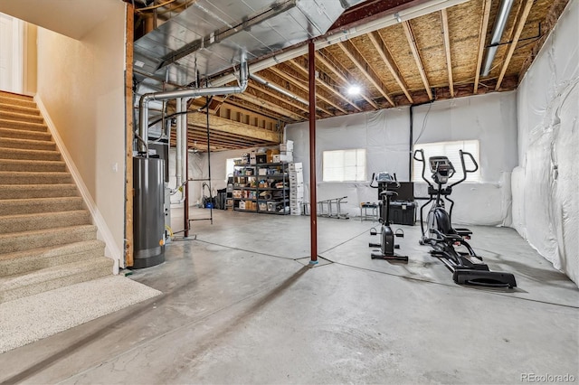 26155 E Euclid Dr, Aurora, CO 80016 - below grade area featuring water heater and stairs