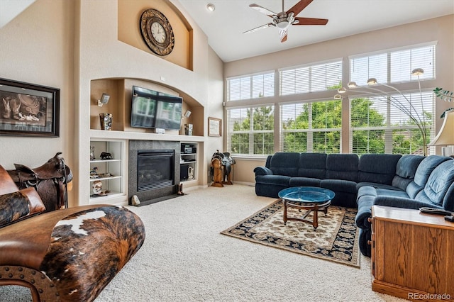 26155 E Euclid Dr, Aurora, CO 80016 - carpeted living room featuring a ceiling fan, healthy amount of natural light, high vaulted ceiling, built in features, and a fireplace