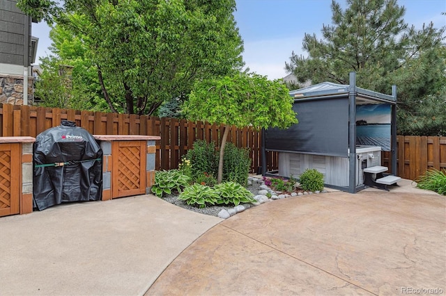 26155 E Euclid Dr, Aurora, CO 80016 - view of patio / terrace featuring a hot tub and grilling area