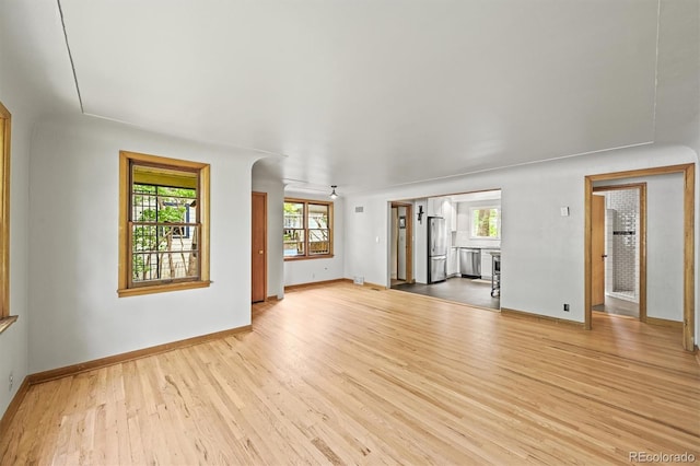 5355 S Windermere St, Littleton, CO 80120 - unfurnished living room featuring wood finished floors and baseboards