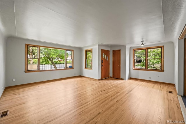 5355 S Windermere St, Littleton, CO 80120 - unfurnished living room with light wood-style floors, baseboards, and a ceiling fan