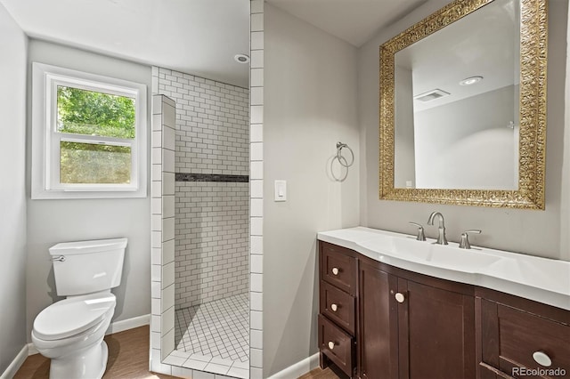 5355 S Windermere St, Littleton, CO 80120 - bathroom featuring vanity, tiled shower, toilet, and baseboards