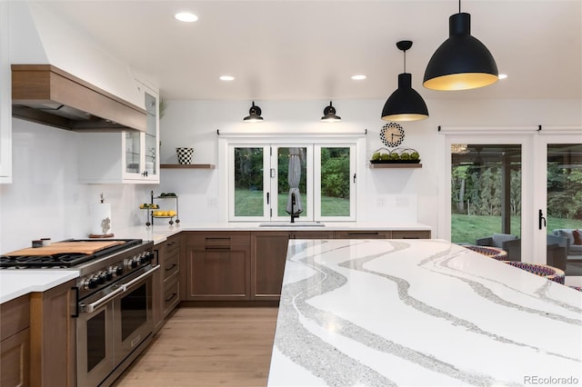 1 Club Ln, Littleton, CO 80123 - kitchen with range with two ovens, open shelves, french doors, plenty of natural light, and recessed lighting