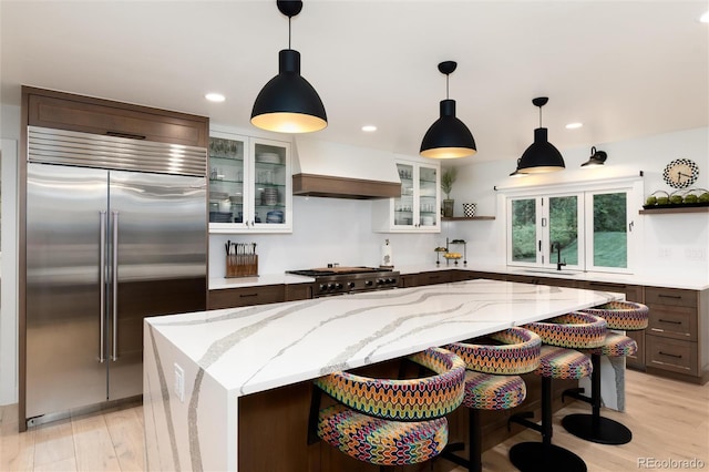 1 Club Ln, Littleton, CO 80123 - kitchen featuring built in refrigerator, open shelves, custom range hood, range, and recessed lighting