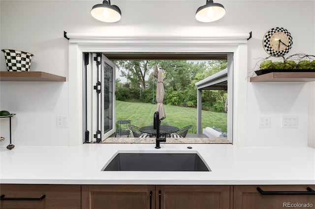 1 Club Ln, Littleton, CO 80123 - kitchen featuring open shelves, light countertops, and dark brown cabinetry