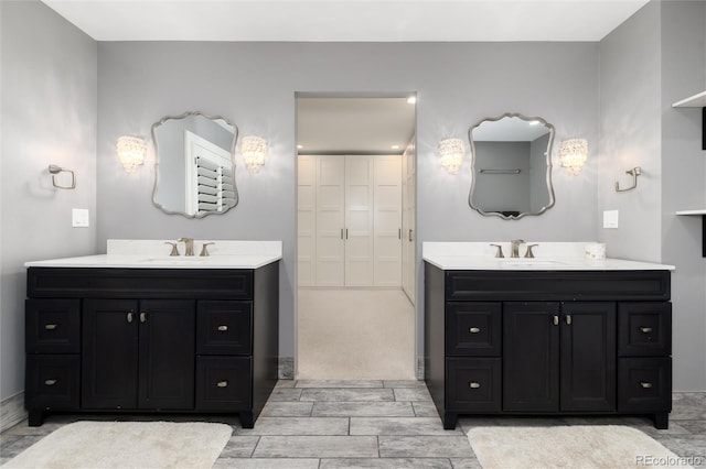 1 Club Ln, Littleton, CO 80123 - full bathroom featuring two vanities and wood finish floors