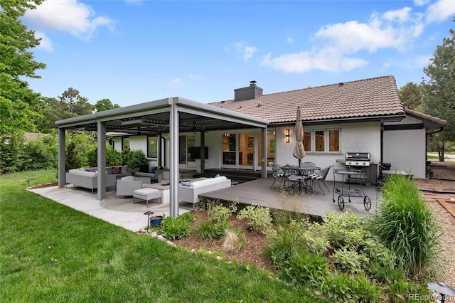 1 Club Ln, Littleton, CO 80123 - rear view of property featuring an outdoor hangout area, a tile roof, a lawn, a chimney, and a wooden deck