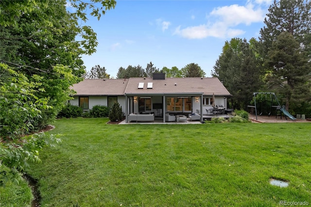 1 Club Ln, Littleton, CO 80123 - rear view of property with an outdoor hangout area, a patio area, a tiled roof, and a lawn