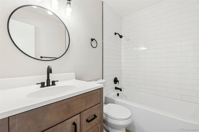 full bathroom with vanity, toilet, and tiled shower / bath combo