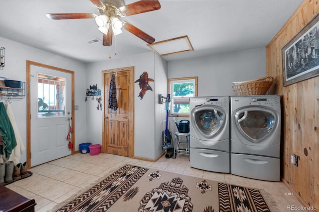 laundry room with separate washer and dryer, light tile patterned floors, and ceiling fan