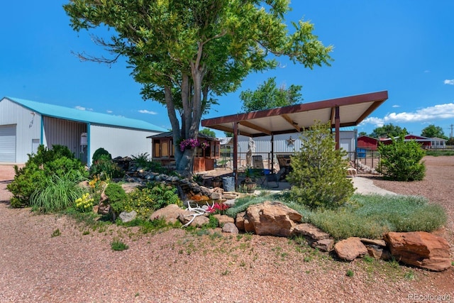 exterior space featuring an outdoor structure and a garage