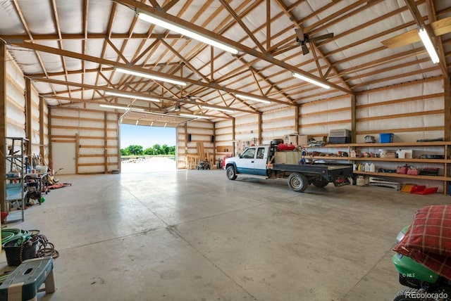 garage featuring a workshop area and ceiling fan