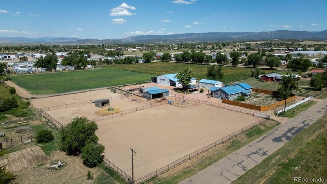 birds eye view of property with a mountain view