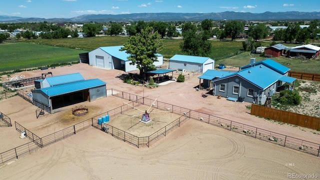 birds eye view of property with a mountain view