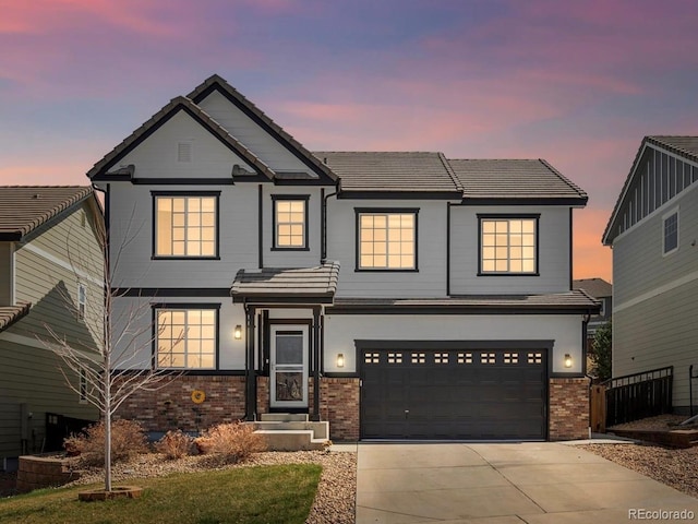2853 Black Canyon Way, Castle Rock, CO 80109 - craftsman-style house featuring brick siding, a tile roof, a garage, and driveway