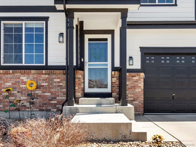 2853 Black Canyon Way, Castle Rock, CO 80109 - property entrance with brick siding and a garage