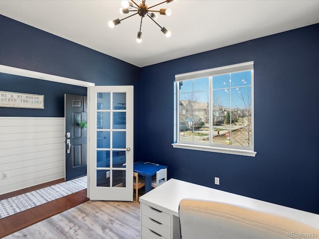 2853 Black Canyon Way, Castle Rock, CO 80109 - home office featuring light wood-style floors, french doors, an inviting chandelier, and vaulted ceiling