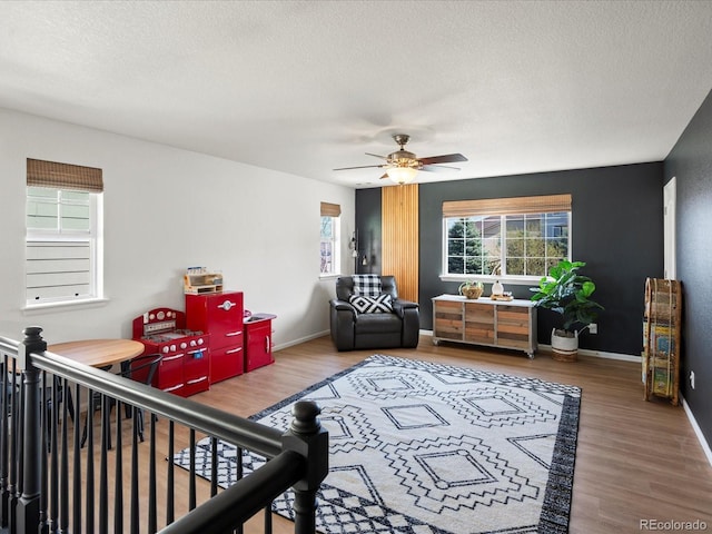 2853 Black Canyon Way, Castle Rock, CO 80109 - bedroom featuring baseboards, a ceiling fan, wood finished floors, and a textured ceiling