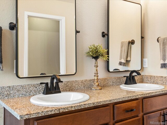 2853 Black Canyon Way, Castle Rock, CO 80109 - full bathroom featuring double vanity and a sink