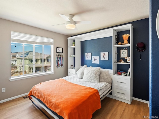 2853 Black Canyon Way, Castle Rock, CO 80109 - bedroom featuring light wood-type flooring, ceiling fan, and baseboards