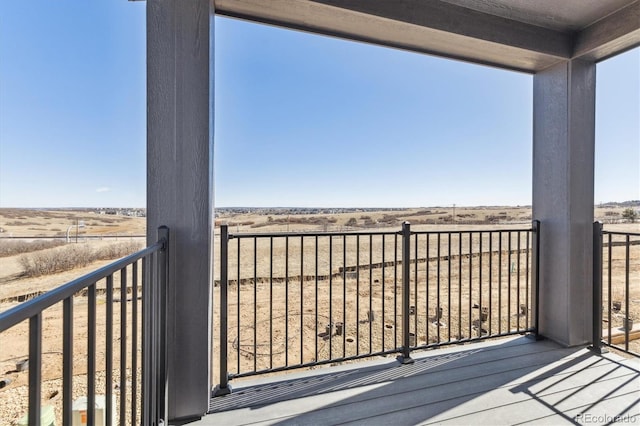 balcony featuring a rural view