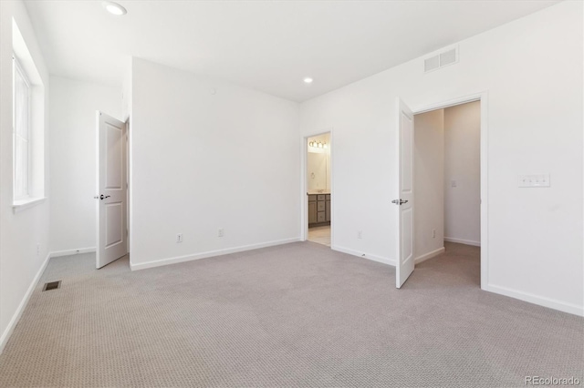 unfurnished bedroom with recessed lighting, baseboards, visible vents, and light colored carpet