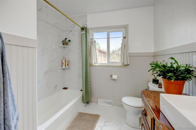 full bathroom featuring marble finish flooring, toilet, vanity, shower / bathtub combination with curtain, and baseboards