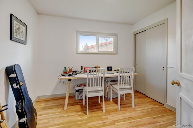 dining area with light wood finished floors