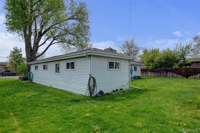 view of side of home with a chimney