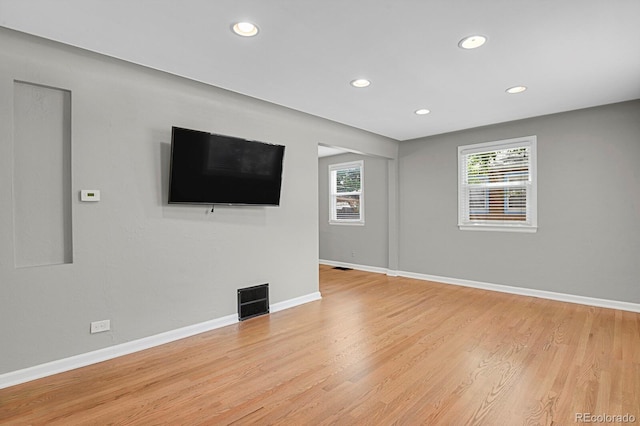 1720 S Madison St, Denver, CO 80210 - unfurnished living room featuring recessed lighting and light wood-style flooring