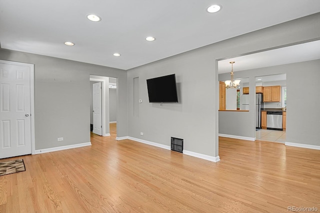1720 S Madison St, Denver, CO 80210 - unfurnished living room with a chandelier, light wood-type flooring, and recessed lighting