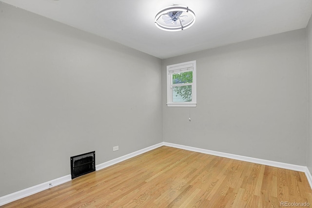 1720 S Madison St, Denver, CO 80210 - spare room featuring a fireplace and light wood-type flooring