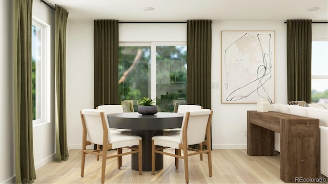 1159 Redfish Pt, Colorado Springs, CO 80904 - dining space with light wood-style flooring and baseboards