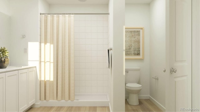 1159 Redfish Pt, Colorado Springs, CO 80904 - bathroom featuring a tile shower, vanity, and wood finished floors