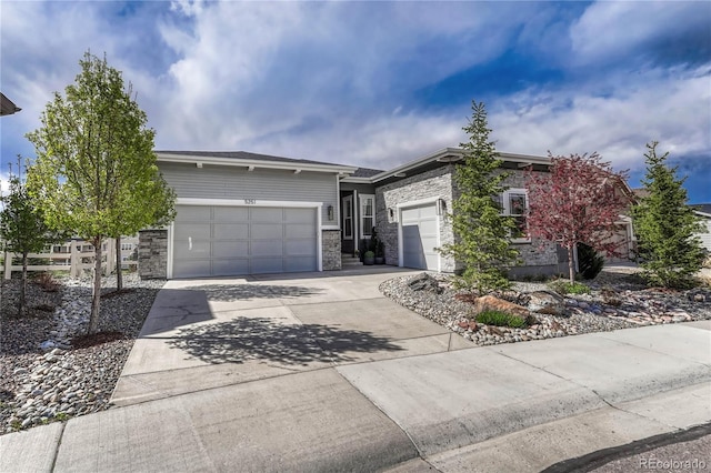 5251 Silver Hare Ct, Castle Rock, CO 80104 - view of front of home with a garage, stone siding, and concrete driveway