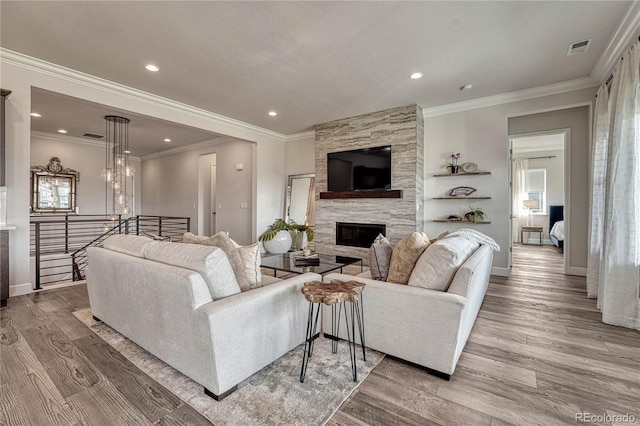 5251 Silver Hare Ct, Castle Rock, CO 80104 - living room with a fireplace, recessed lighting, wood finished floors, and visible vents