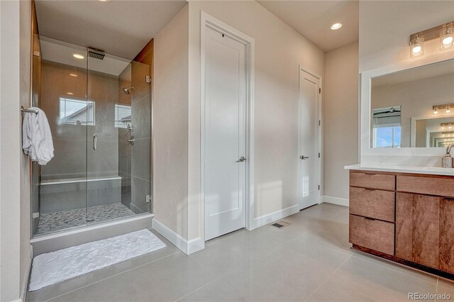 5251 Silver Hare Ct, Castle Rock, CO 80104 - full bathroom featuring baseboards, recessed lighting, a stall shower, and vanity