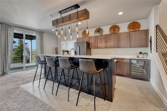 5251 Silver Hare Ct, Castle Rock, CO 80104 - kitchen with wine cooler, light countertops, stainless steel refrigerator with ice dispenser, and light colored carpet