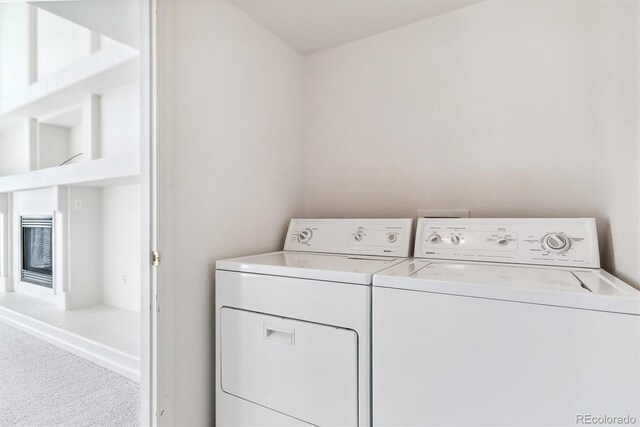 washroom with carpet and separate washer and dryer